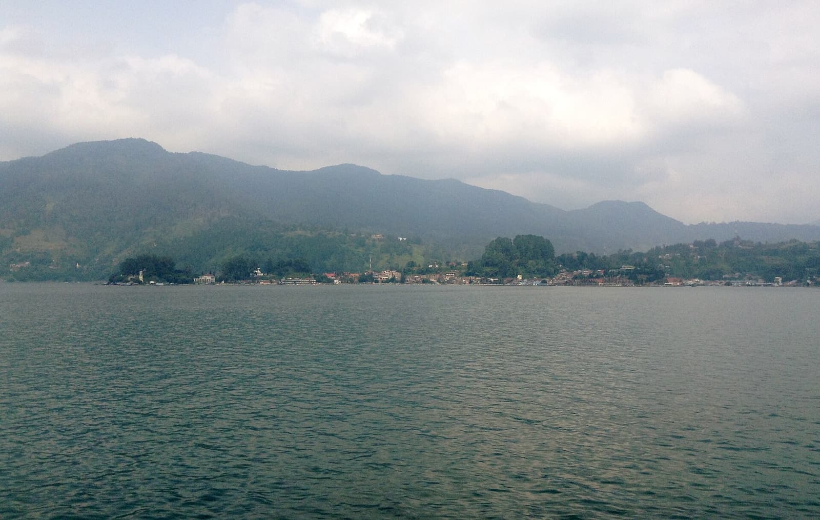 The lakeside town of Parapat seen across the water of Lake Toba