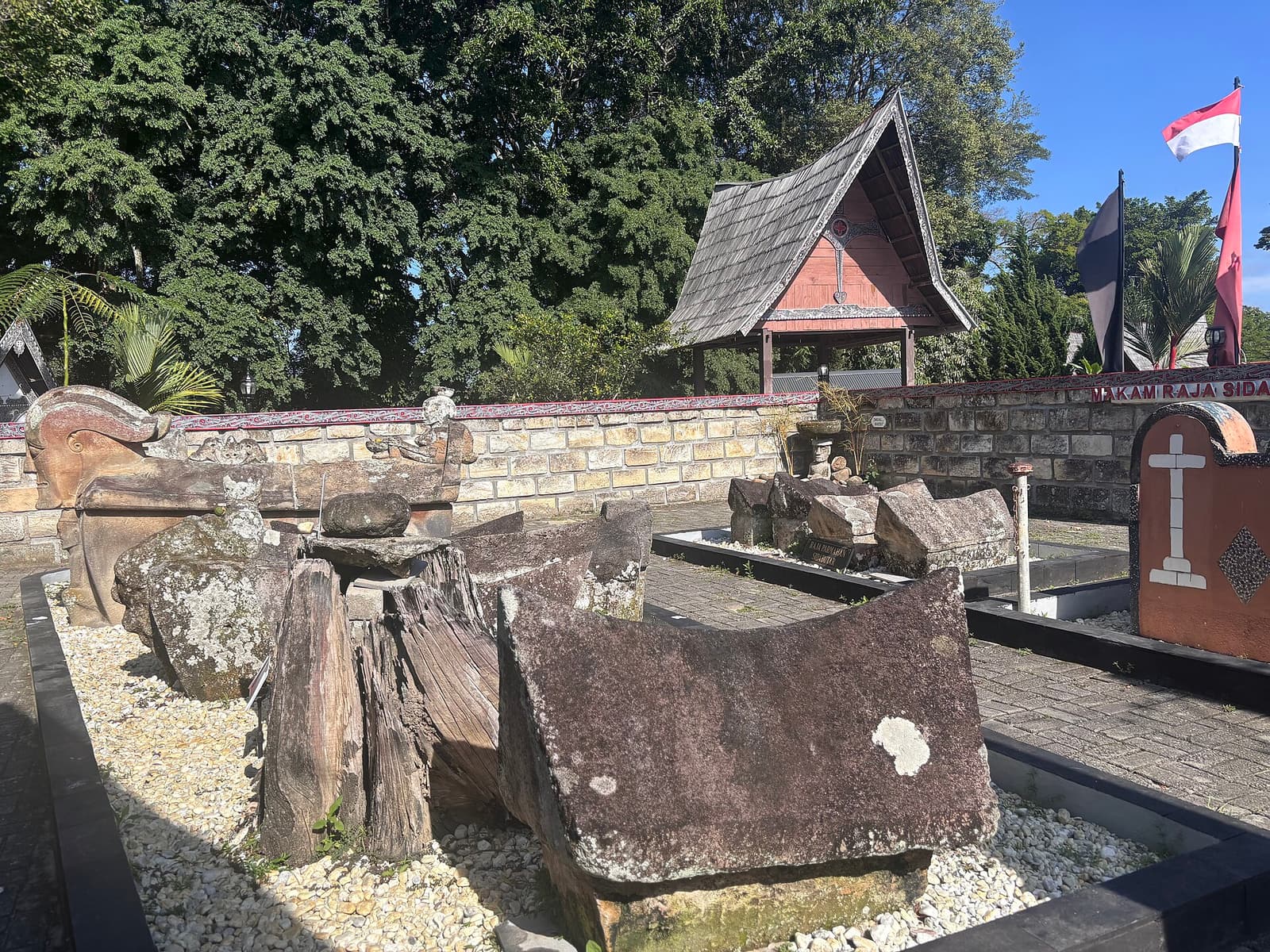 Carved stone sarcophagi of the Sidabutar kings in Tomok