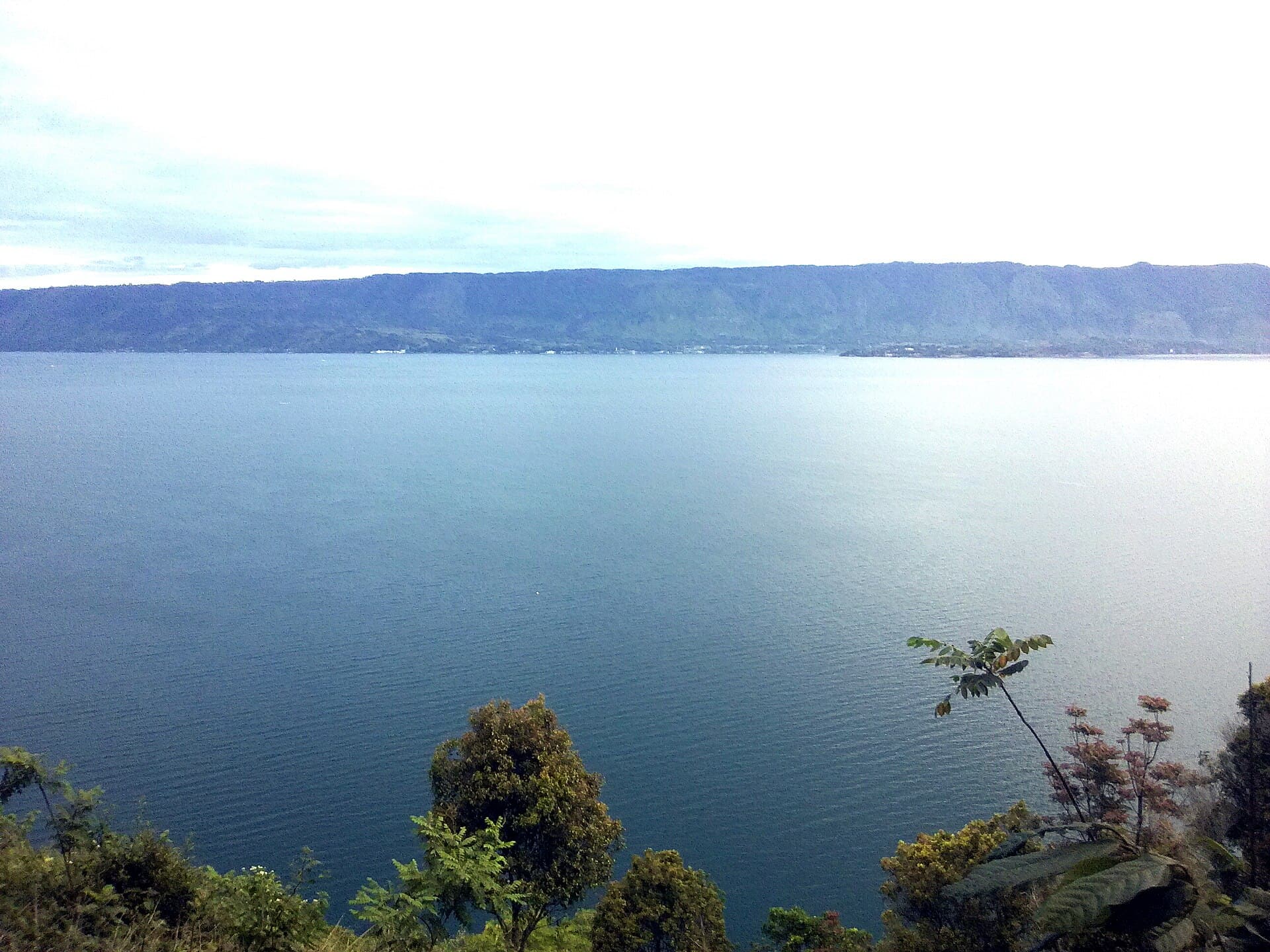 Still water of Lake Toba seen from the hills of Samosir